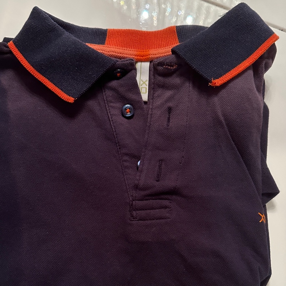 Polo Shirt in Navy and Orange. Some Sun discoloration